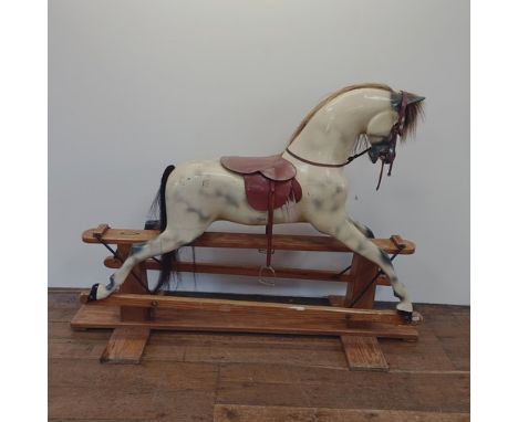 A large painted rocking horse, by Haddon Rockers, Wallingford, Oxfordshire No 36165, 185 cm widefibreglass, not wood