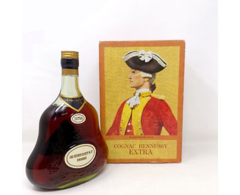 A bottle of Hennessy Extra cognac, boxed