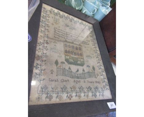 A 19th century sampler, with religious text, decorated with foliage and a house, dated 1843, 17ins x 12ins