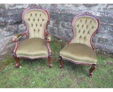 A Victorian deep button back Grandfather's and Grandmother's chair, with green upholstery