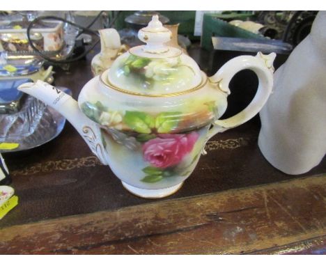 A Royal Worcester teapot, signed M Blake, decorated with roses