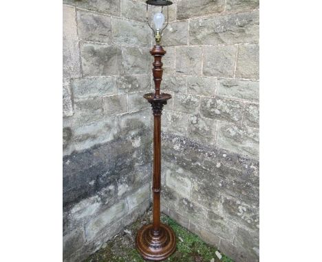 A mahogany standard lamp, with part reeded column, height 68ins