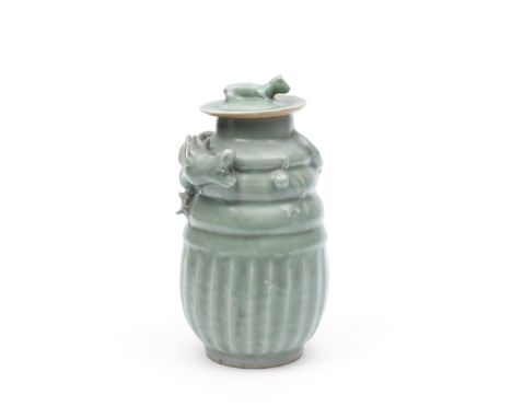 A Longquan celadon'funerary' jar and coverSouthern Song DynastyThe ovoid body carved around the exterior with lobes, rising t