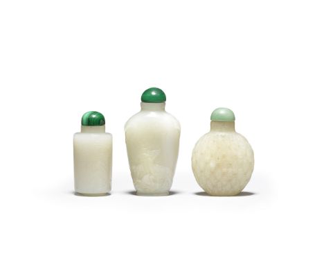 Three pale green jade snuff bottles18th/19th centuryComprising a bottle carved in low relief with a stag beside lingzhi fungu