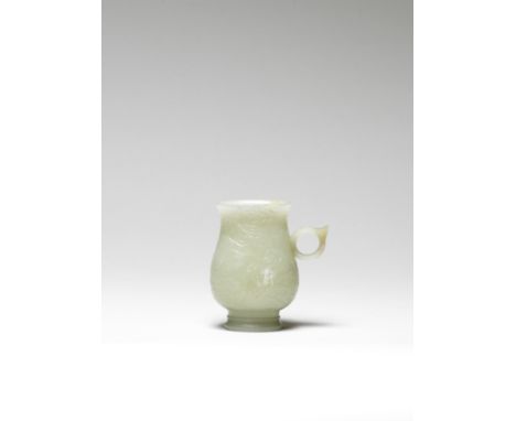 A rare pale green jade cup, ZhiYuan/Ming DynastyThe pear-shaped body rising from a tall foot to a flaring mouth, the exterior