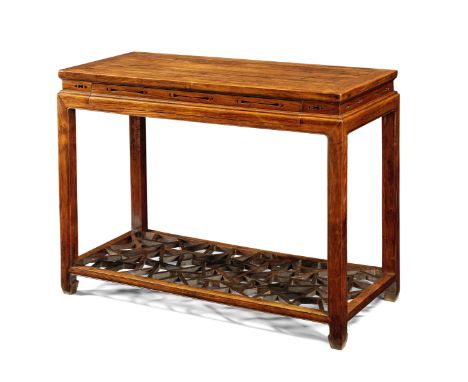 A very rare huanghuali and hongmu scholar's table17th/18th century The rectangular top with a mitred frame and moulded edge a