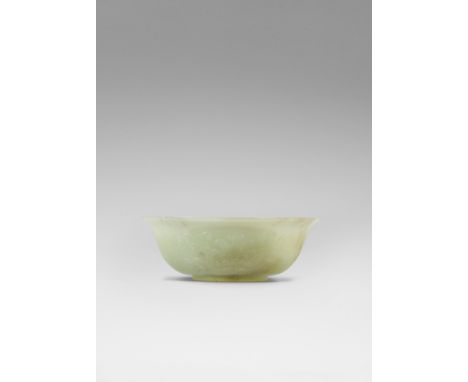 A yellow and russet jade bowlMid Qing DynastyDeftly carved rising from a short straight foot to a flaring rim, carved around 