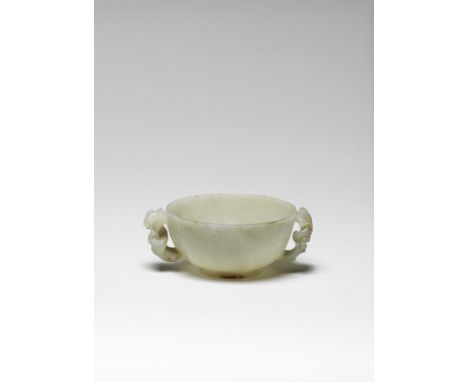 A rare pale green and russet jade chilong-handled cupMing DynastyExpertly carved with deep rounded sides, supported on splaye