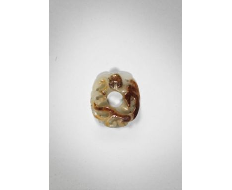 A rare archaistic white and russet jade She-shaped pendantProbably Song/Yuan DynastyCrisply carved as an oval disc, with a wr