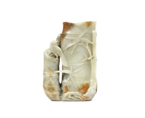 A pale green and russet jade 'bamboo' vaseMid Qing DynastyCrisply carved as a hollow bamboo trunk with naturalistically-groov