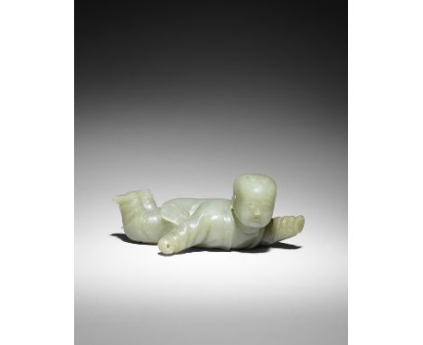 A rare large green and russet jade 'boy' brush rest17th centuryThe figure of the boy crisply carved wearing loose flowing tun