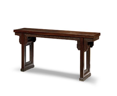 A rare tielimu altar table, Tiao'an18th centuryThe dense rectangular panel top set above an elaborately carved apron of meand