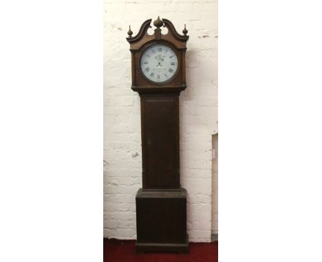 A George III oak thirty hour longcase clock by J Hutchenson Retford having swan neck pediment and painted circular dial with 