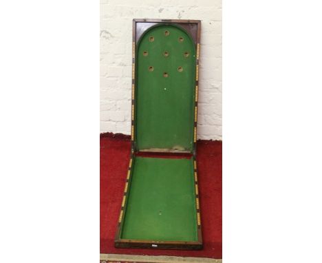 An antique folding bagatelle table.