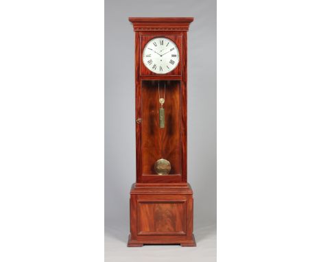 A mahogany longcase clock by J. Armstrong, Manchester. The eighteenth century eight day regulator movement has a circular sil