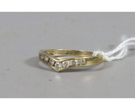 A ladies 9ct gold and paste set wish bone ring, UK size N. 1.75 grams.