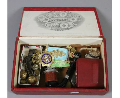 A cigar box containing collectables including silver gilt roll of honour medal, Constabulary cufflinks and cap badges.