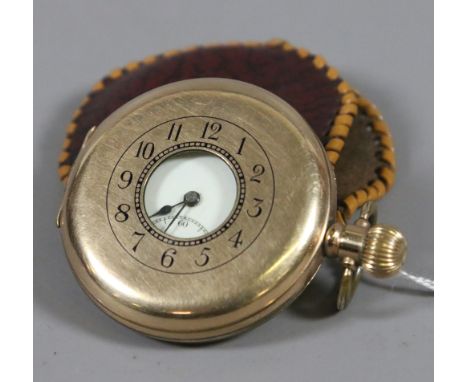 A gentleman's gold plated half hunter pocket watch with enamel face and subsidiary dial.