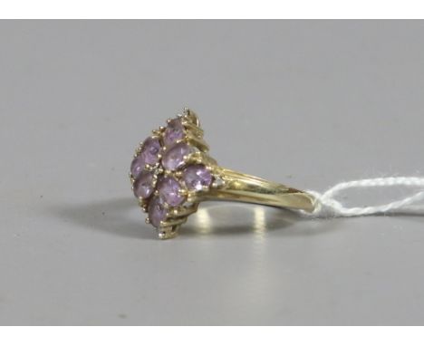 A ladies 9ct gold, amethyst and diamond lozenge shaped cluster ring, UK size P. 3.01 grams.