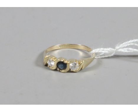 A 9ct gold ring set with sapphires and cubic zirconias size R.