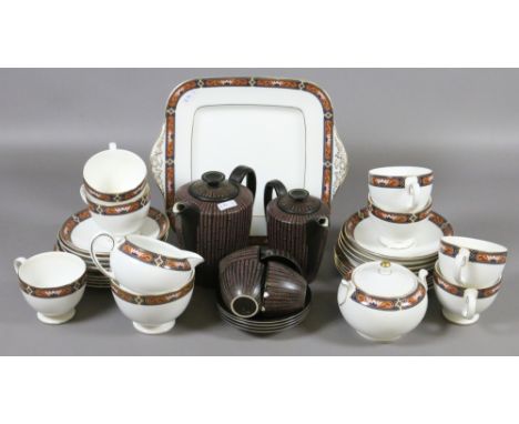 A Wedgwood part teaset decorated with the Chippendale design   (twenty seven pieces)  along with a Poole part coffee set with