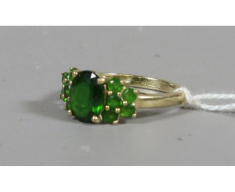 A ladies 9ct gold and synthetic emerald cluster ring UK size N 2.41 grams.