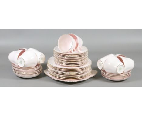 A Tuscan china part tea service pink ground and with gilt edging (approximately forty pieces).