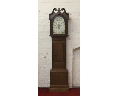 A George III oak and mahogany thirty hour longcase clock by Henry Best Skipston with swan neck pediment, fluted columns and p