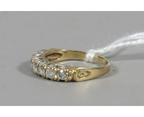 A ladies 9ct gold and paste set seven stone dress ring UK size M. 2.35 grams.