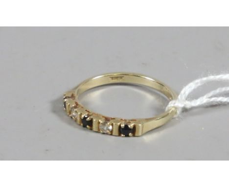 A 9ct gold ring set with sapphires and cubic zirconias size L1/2.