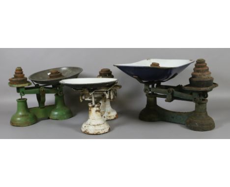 Three sets of cast iron kitchen scales and graduated weights.