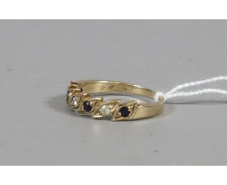 A ladies 9 carat gold diamond and sapphire set ring, 2.57 grams.