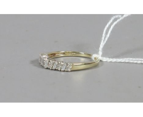 A 9ct gold diamond half eternity ring, size O.