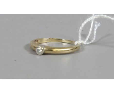 A ladies 9ct gold and solitaire diamond ring, UK size R. 2.19 grams.