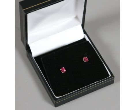 A pair of 9ct gold and ruby stud earrings.