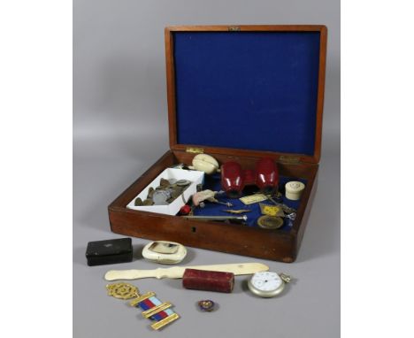 A mahogany box and contents of collectables to include pocket watch, horn snuff boxes, coins, enamel badges, etc.