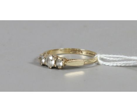 A ladies 9ct gold and paste set three stone dress ring UK size P.5. 1.78 grams.