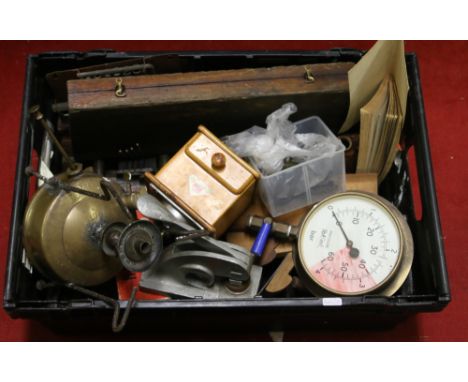A box of woodworking and engineering tools including antique moulding planes, cast oil lamp bases, brass pressure gauge, coff