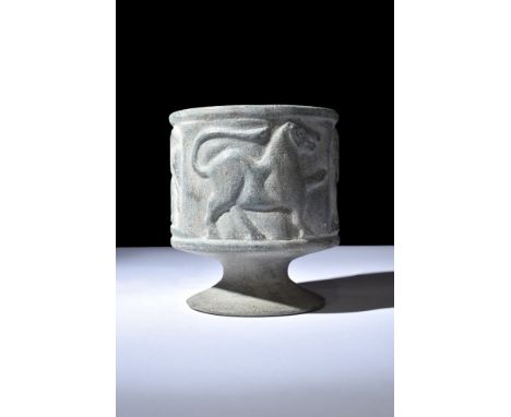 Ca. 3rd-2nd millennium BC.This tubular cup, endowed with a pronounced rim, rests elegantly atop a splayed foot, elevating bot