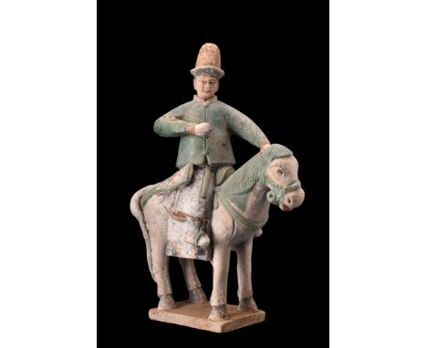 Ca. 1368-1644 AD, or later.A moulded terracotta figure depicting a rider on horseback, with the animal shown in a standing po