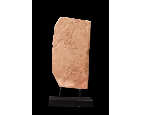 Old Kingdom, ca 2300 BC.A sandstone relief section of the sub-rectangular form, carved in raised relief with the bust of an o