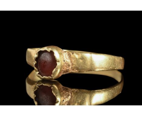 Ca. 6th-7th century AD.A gold finger ring commences with a thin round hoop that envelops the finger with a delicate embrace. 