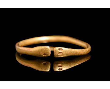 Ca. 1st century AD.A gold finger ring of open type. The shank, a round testament to proportion, gently deviates from perfect 