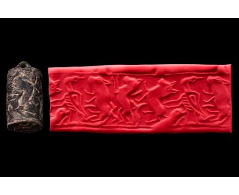 Ca. Early 3rd millennium BC.A black stone hammer seal, likely from Old Elam (Iran), early 3rd millennium BC. It depicts lions
