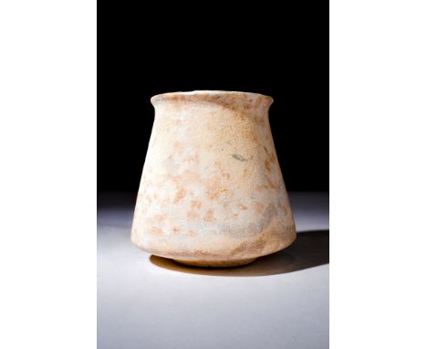 New Kingdom, ca. 1550-1070 BC.A stone vessel stands resolute upon a raised base, its form an embodiment of subtlety and elega