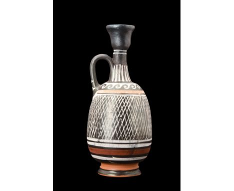 Ca. early 4th century BC.A fine wheel-thrown pottery lekythos, crafted with exceptional artistry, showcases an exquisite comb