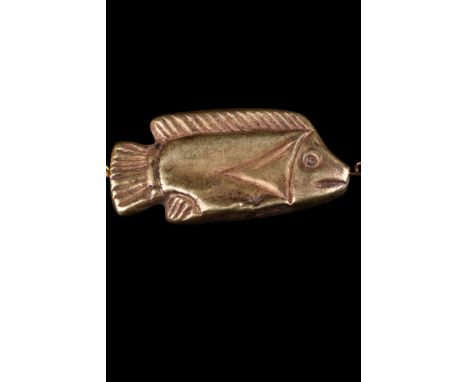 New Kingdom, ca. 1550-1069 BC.A golden amulet in the shape of a tilapia fish. A cast gold amuletic bead with a suspension hol