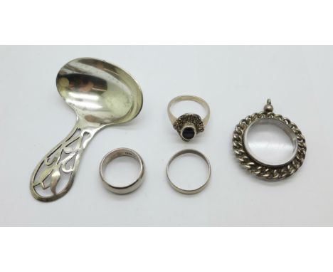 Three silver rings including two hallmarked c1900, a caddy spoon and a pendant mount 