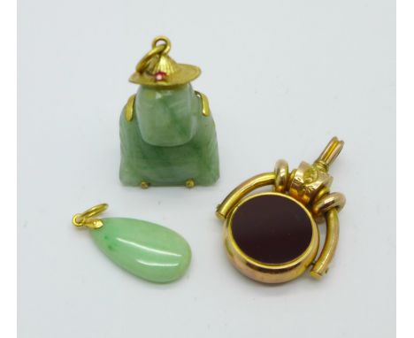 A Victorian plated fob and two jade pendants 