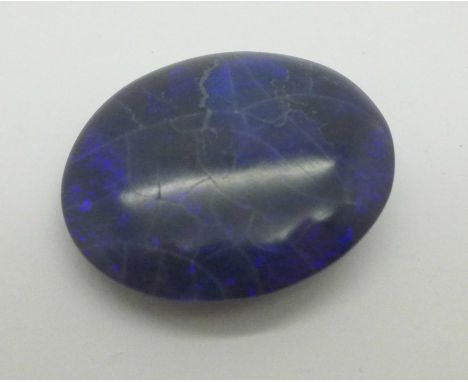 An unmounted black opal, over 47 carats, 26mm x 32mm 